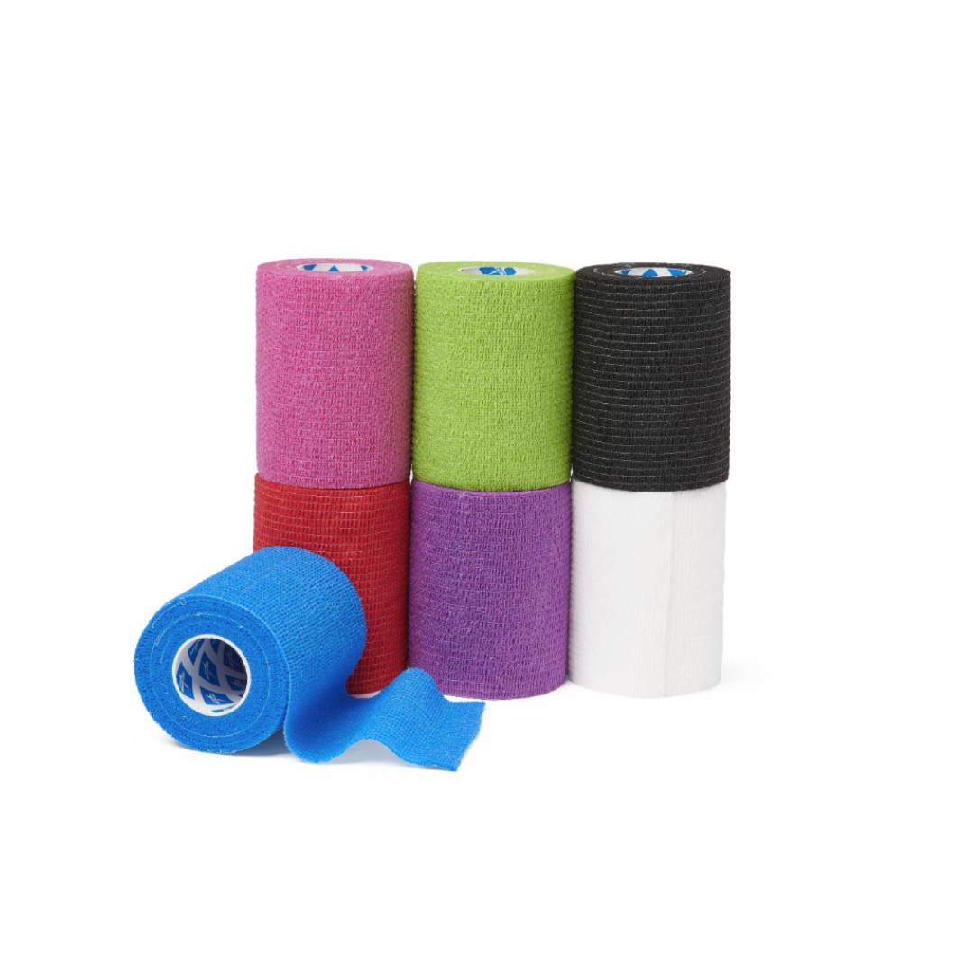 Six rolls of Medline Nonsterile Self-Adherent Wrap Color Packs—in blue, red, green, purple, black, and white—are stacked in two rows with the blue wrap partially unrolled at the front on a plain white background.